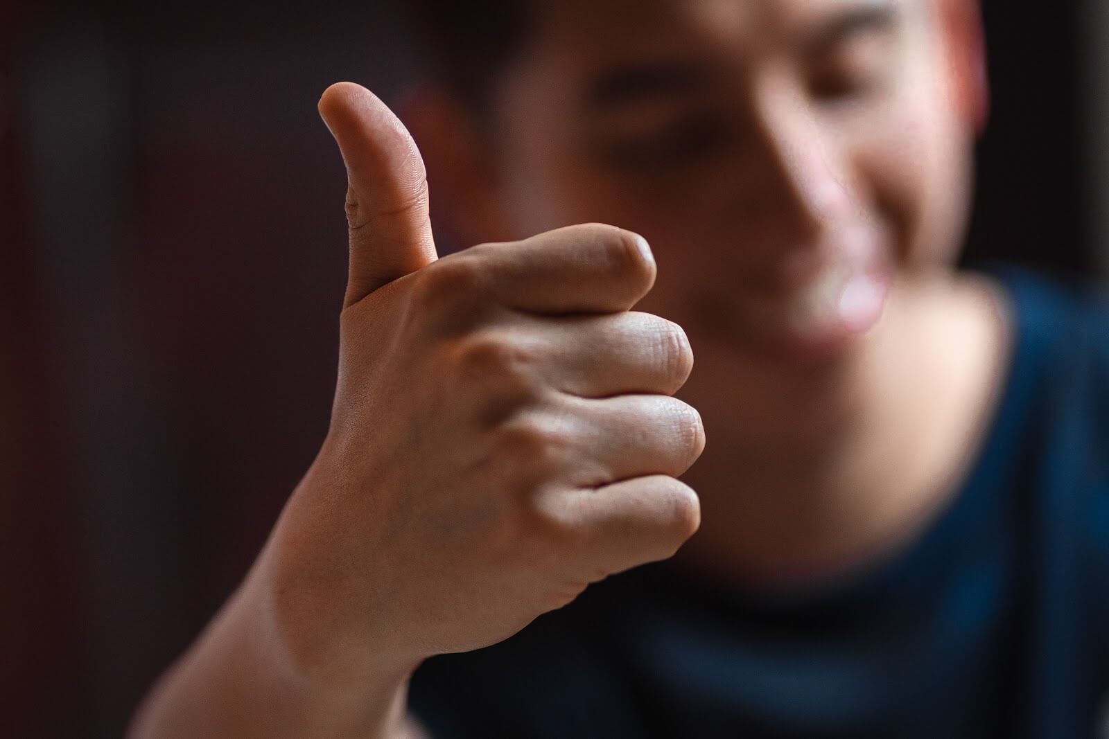 a man giving a thumbs up