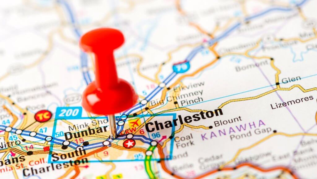 A red push pin on a map of Charleston