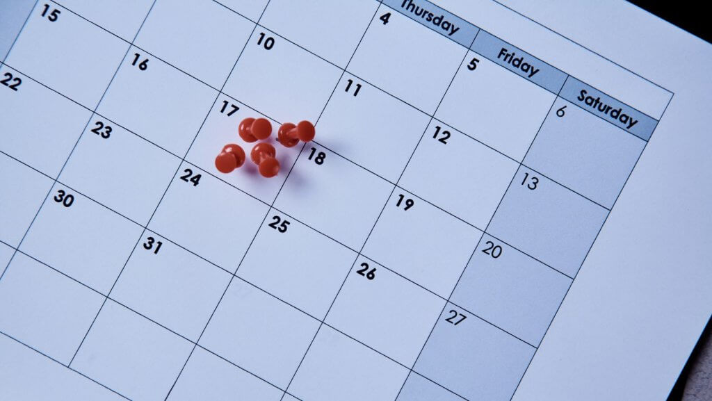 A calendar with red pins on the 17th Scheduled Shredding